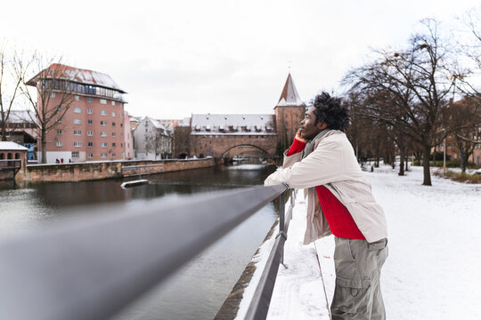 Man in casual clothing enjoying winter view in historic city