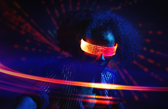 Person wearing neon VR set dancing in nightclub with futuristic lights