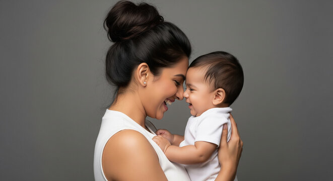 Loving mother and baby bonding with happy smiles