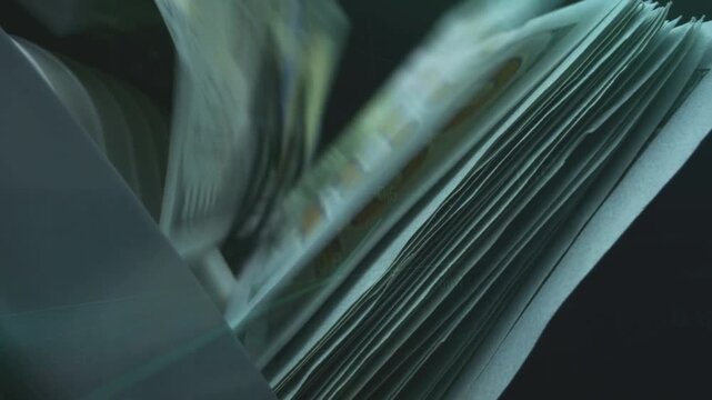Electronic money counting machine processing stacks of US dollar bills illustrating financial liquidity and high-speed banking