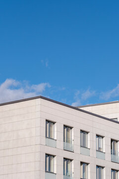 Minimalism in modern building architecture showing a clean facade with windows against a sky copyspace composition in Stockholm during daylight
