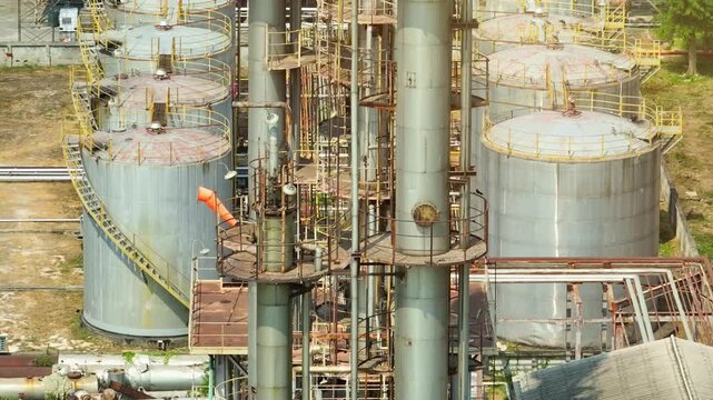 Drone view capturing refinery processing units and storage tanks, emphasizing the transformation of crude oil into usable fuels that sustain transportation networks and industrial power systems.
