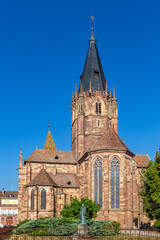 Fototapeta premium Wissembourg offers sights of historic Abbey Sts Peter and Paul church against a clear blue sky. A great destination for travelers.