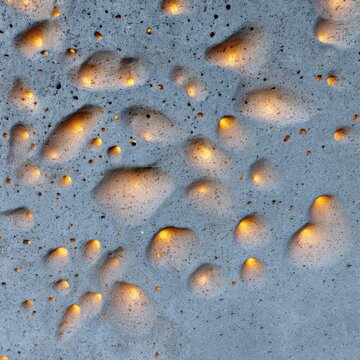 Texture of translucent concrete lit from behind. Thousands of tiny glowing pinholes in rough grey stone. Minimalist architectural material.