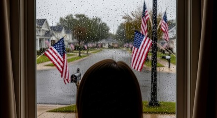 Obraz premium American flags hanging on street pole.