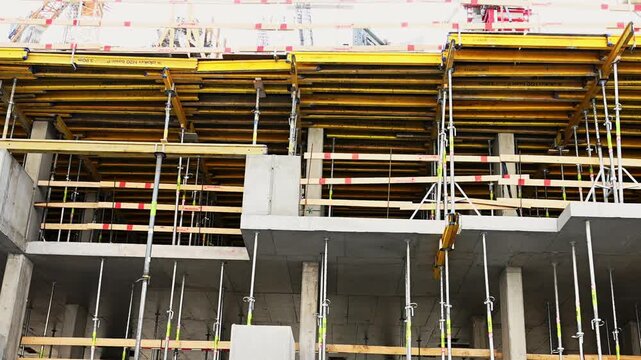Construction site with formwork and support jacks for concrete slabs