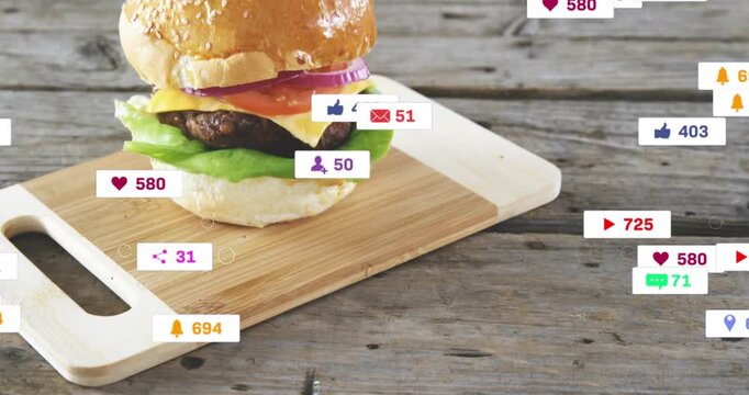 Bamboo board sliding in, burger building, animated heart icons orbiting then fading marketing