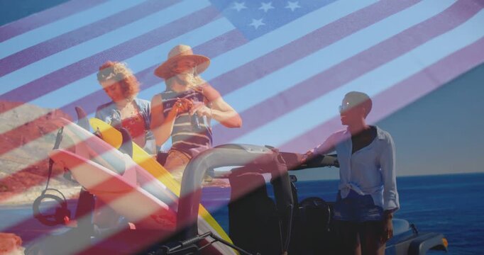 Passing bottle, friends leaning on red jeep at coastline, surfboards, wide-brim hat, flag overlay