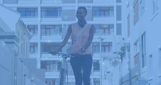 Woman starting far end, walking bicycle toward camera, commuting, bluish overlay adding sparkles