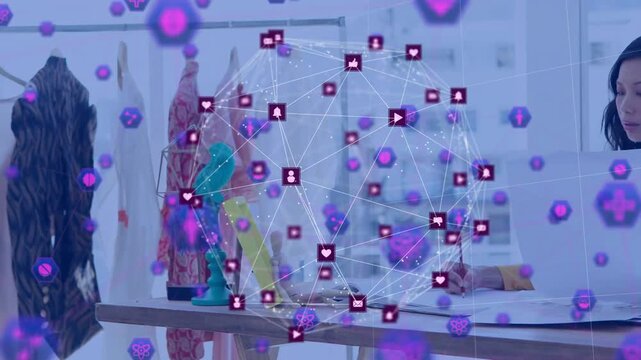 Fashion designer writing on patterns while icon globe forming, floating over table showing feedback