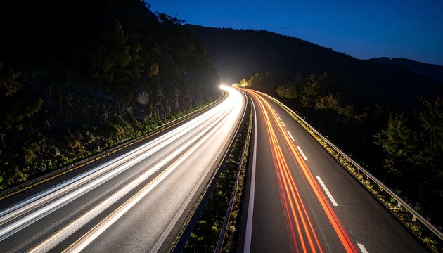 Traffic flowing on a highway at dusk with light trails