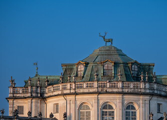 Fototapeta premium Stupinigi, turin, italy. March 23, 2026. Stupinigi hunting lodge, a unesco world heritage site near turin, italy, features a iconic bronze stag sculpture atop its dome