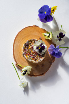Floral spring cheese, a dietary product. Spring Easter menu. Unusual farm cheeses. Sunny mood