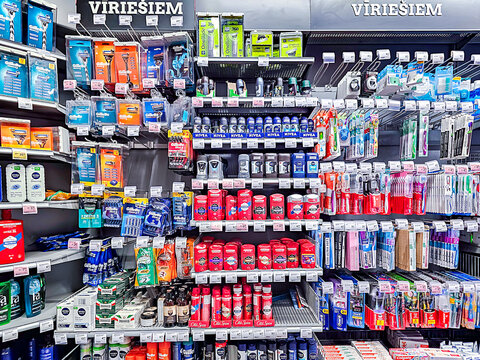 LATVIA, RIGA, MARCH 25, 2026: Shelves with men's shampoos, foams and razor blades at the Rimi Baltic hypermarket in Riga, Latvia. Rimi Baltic is a major retailer in the Baltics.