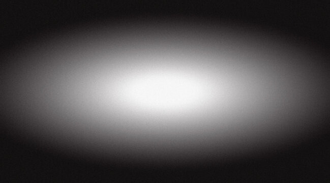 Abstract grainy black and white gradient background with a bright center and dark edges