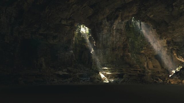 Sunlit cavern interior with dark pool, rugged limestone walls, distant light shafts cutting through dust, reflective water surface creating mirror highlights,