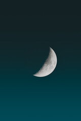 Waxing crescent moon in the night sky © Adam Rhodes