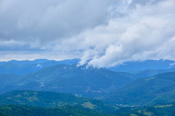 Fototapeta premium Blue Mountain Ranges under Cloudy Sky Vista