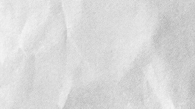 Gray Crumpled Paper Halftone Texture Loop.Animated creased paper background with a subtle minimalist halftone dot pattern.