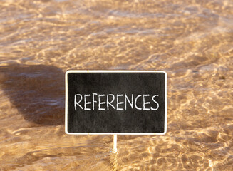 Naklejka premium References or reference symbol. Concept word References on beautiful black blackboard. Beautiful Red sea water background. Business references or reference concept. Copy space.