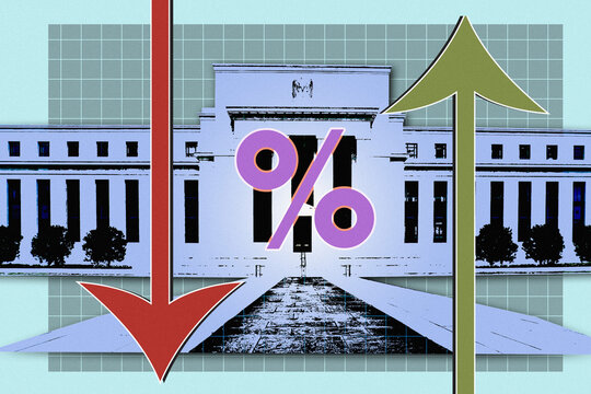 Up and down arrows and percentage sign in front of Federal Reserve Building