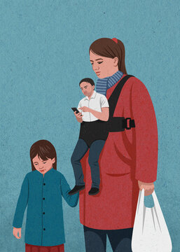 Woman with daughter and shopping carrying husband in baby carrier
