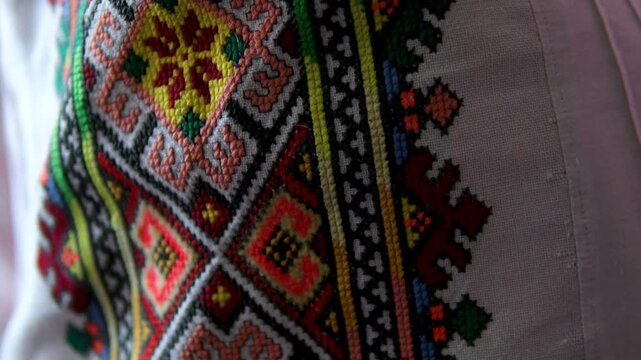 Colorful Ukrainian embroidered cushions with floral motifs creating warm folk accent and nostalgic atmosphere inspired by ancestral handmade home decoration