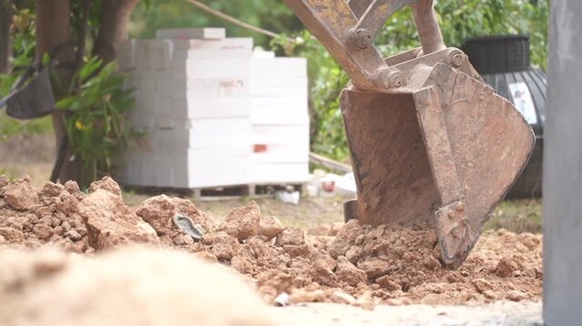Earthmover at Work: A construction scene showcasing a powerful earthmover, diligently excavating soil, a testament to industrious labor and engineering prowess.