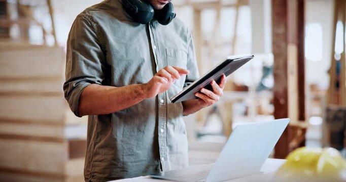 Carpentry, hands and man with tablet in workshop for woodwork order, design review or invoice. Timber manufacturing, carpenter and typing on tech for client email, furniture production and inventory