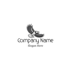 Fototapeta premium A black and white logo featuring an eagle clutching branches with company text