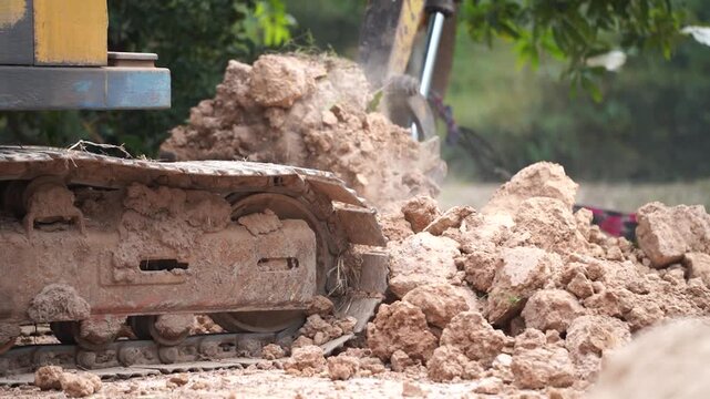 Earth Mover in Action: A robust earth mover, its powerful arm carving into the earth, symbolizes the might of industry and the creation of progress.