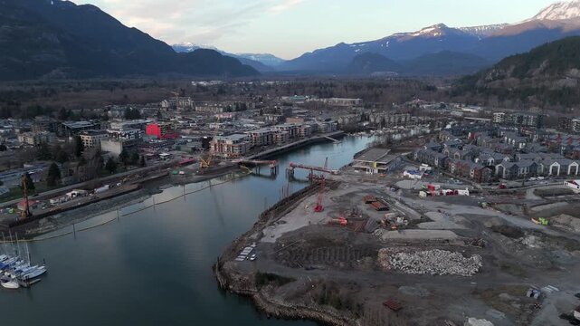 Aerial View Of Mamquam Blind Channel With Pedestrian Drawbridge Under Construction In Squamish, BC, Canada. panning shot