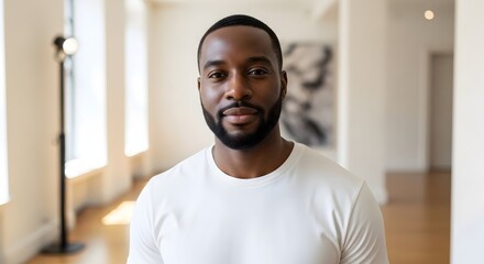 Naklejka premium Portrait of a confident African American man in a bright room.