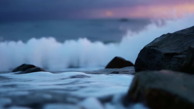 Captivating Waves: A Serene Evening at the Shore with Gentle Ripples and Sparkling Waterfall Splashes Over Rocks, Creating an Enchanting Coastal Atmosphere