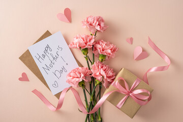 Handwritten Happy Mother's Day card with pink carnations, kraft gift box tied with ribbon and paper hearts on a soft pastel background evoking love, tenderness, celebration and feminine charm © ActionGP