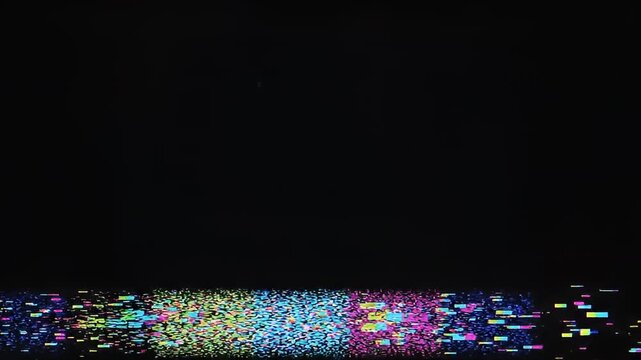 Colorful digital glitch noise with horizontal pixels on black screen
