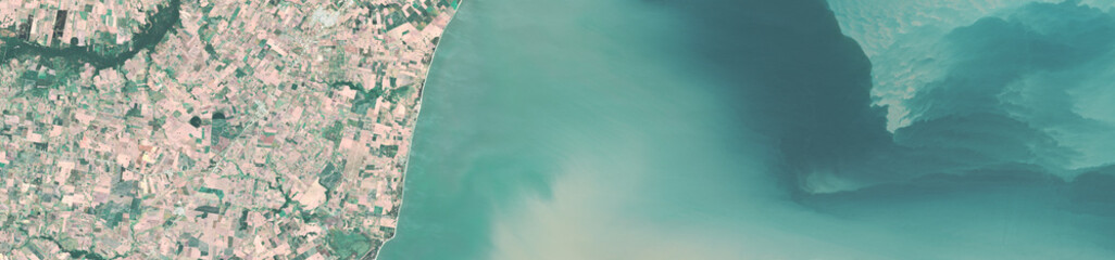 Fototapeta premium Satellite view of Montevideo coastline and urban area, Argentina, July 2025, High-resolution satellite image of Montevideo’s coastal city and surrounding urban area captured in July 2025