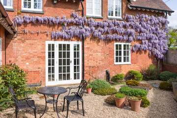 House and garden with patio furniture, UK