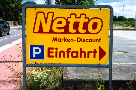 Geeste-Dalum, Lower Saxony, Germany, July 14, 2024 - Sign and parking lot of the Netto discounter grocery store