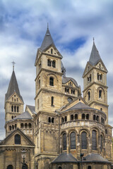 Fototapeta premium Munsterkerk church in Roermond Netherlands view of the apse. Romanesque architecture under overcast cloudy sky