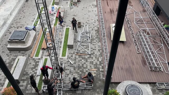 Workers are installing a stage in preparation for an entertainment event on the Teras Malioboro on May 26, 2025 in Yogyakarta, Indonesia