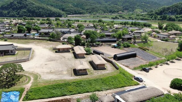 Aerial flyover of Hahoe Folk Village with traditional Hanok and thatched houses, Andong, South Korea