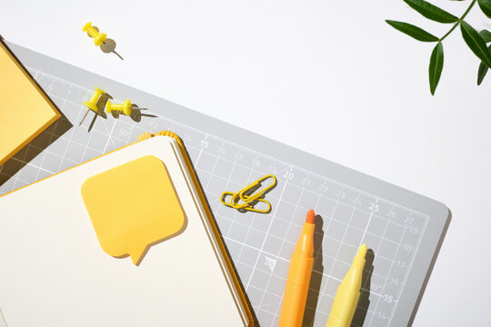 Gray and yellow workspace layout for planning and study on white background. Copyspace