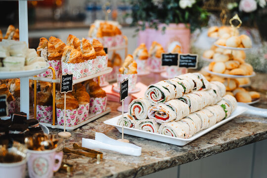 Assorted finger foods and sandwiches on a buffet table
