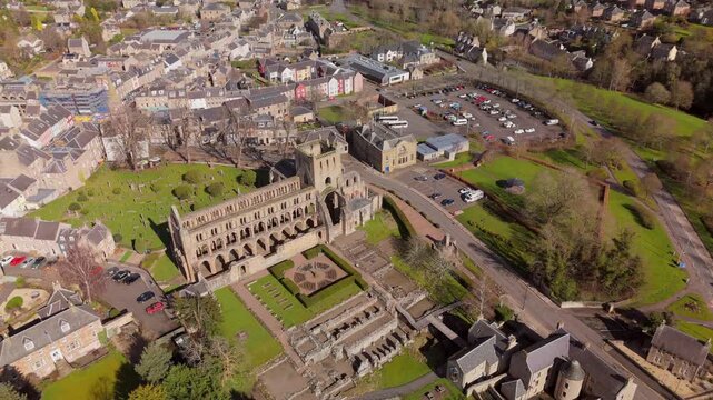 Drone view of Jedburgh, Scottish Borders buildings and hills on a sunny day
