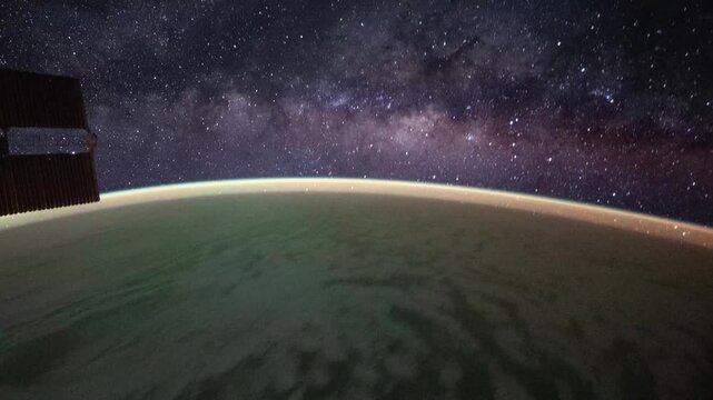 Orbital timelapse Earth night to day transition with sunrise Milky Way and solar panels satellite view from space based on Nasa imagery