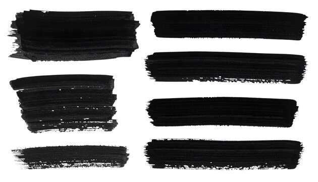 Seven black watercolor brushstrokes on black background, varying shapes and sizes