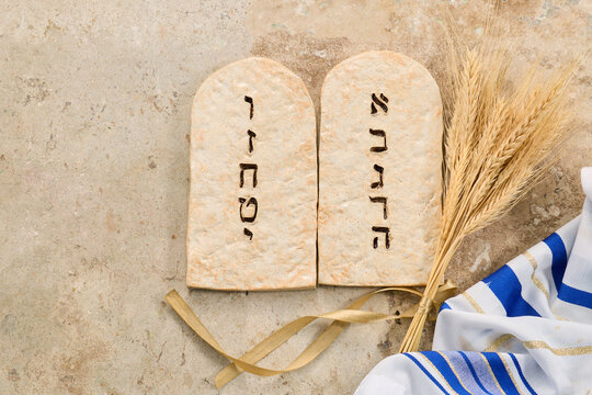 Ten commandments tablets with wheat and tallit celebrating shavuot