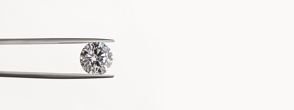 Diamond jewelry concept using tweezers for close-up detail shots
