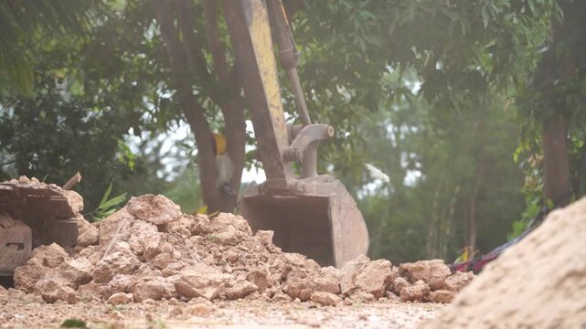 Excavator at Work: The excavator diligently claws into the earth, a symphony of industry and engineering. Witnessing the raw power of the heavy machinery transforming the landscape.
